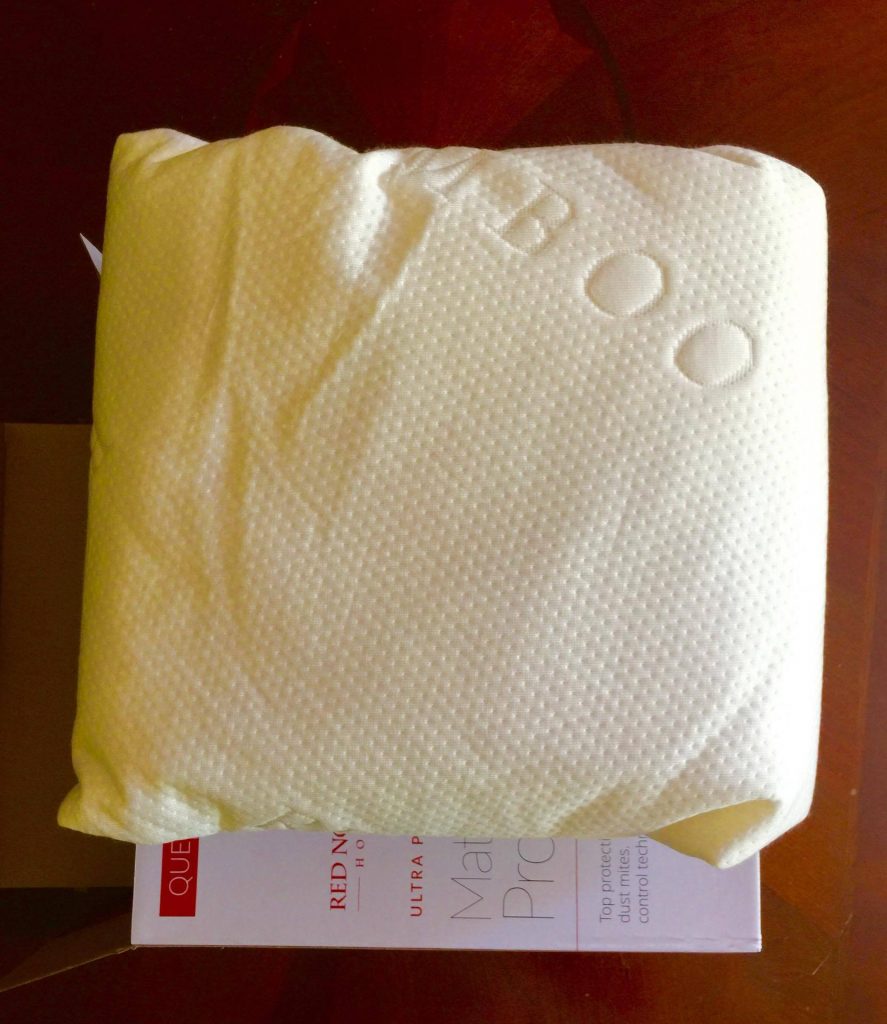 Red Nomad Mattress Protector on Box
